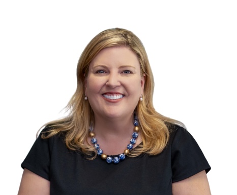 Smiling woman wearing black top and necklace.